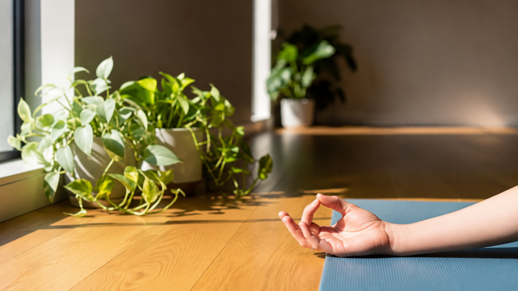 Close-up of a relaxed hand in a yoga mudra demonstrating gentle movement for Carpal Tunnel Syndrome (CTS) symptom relief.
