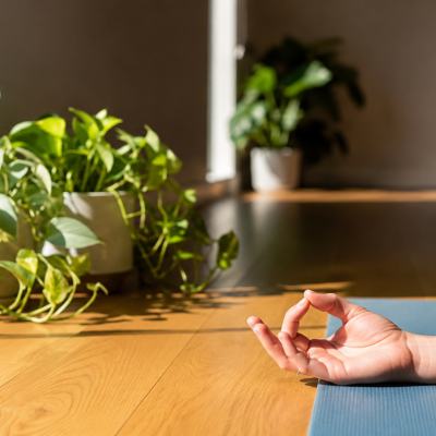 Close-up of a relaxed hand in a yoga mudra demonstrating gentle movement for Carpal Tunnel Syndrome (CTS) symptom relief.