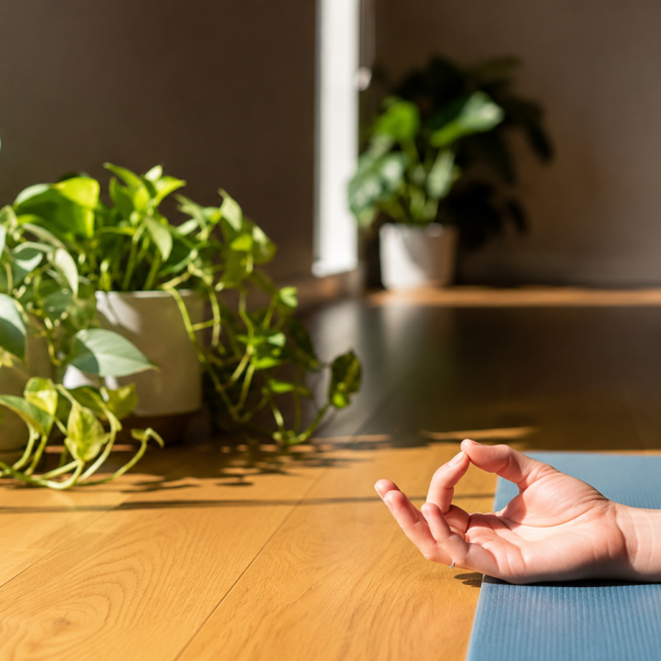 Close-up of a relaxed hand in a yoga mudra demonstrating gentle movement for Carpal Tunnel Syndrome (CTS) symptom relief.