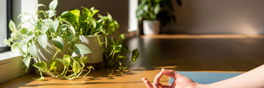 Close-up of a relaxed hand in a yoga mudra demonstrating gentle movement for Carpal Tunnel Syndrome (CTS) symptom relief.
